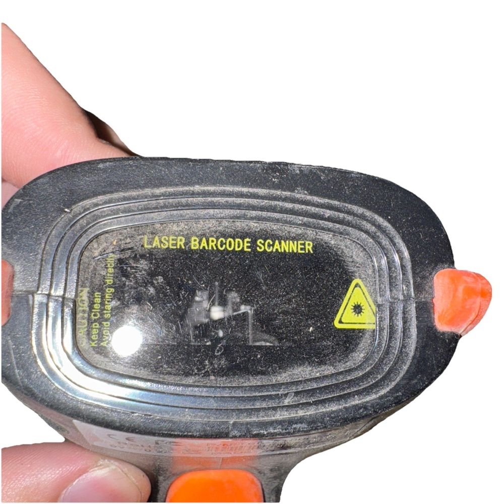 Tera 5100 Barcode Scanner – a hand holding a small electronic device
