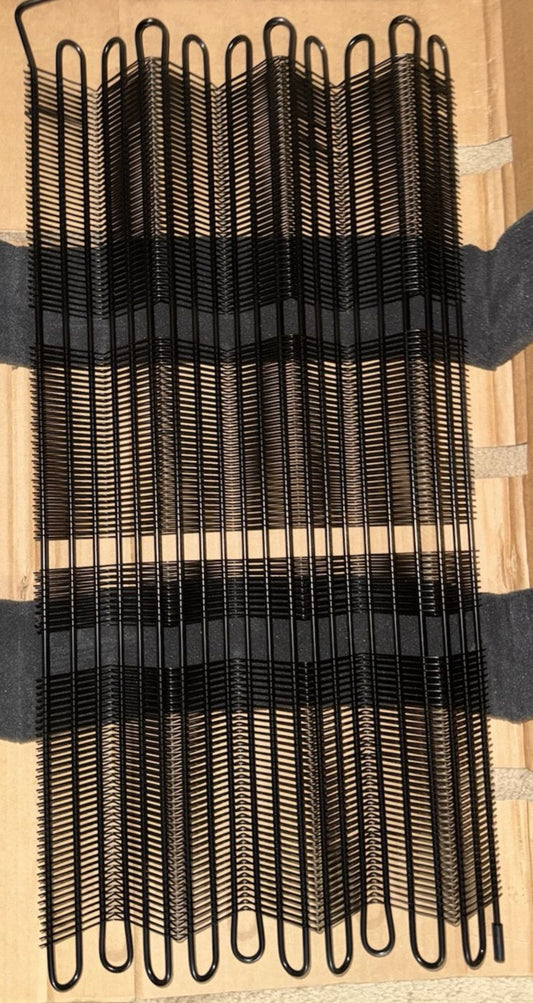Whirlpool WPW10346415 Condenser – a bunch of black combs on a wooden table