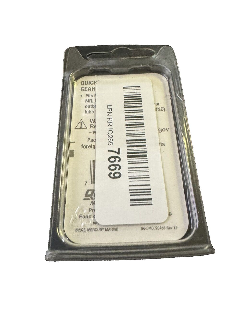 Quicksilver 79953Q04 Lower Unit Gear Lube Drain and Fill Hole Screw and Seal – a close up of a small, metal, plastic, and plastic container
