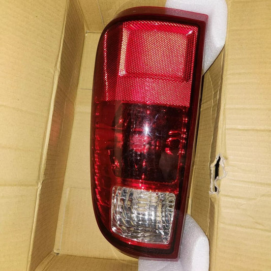 TYC 11-6263-01-1 Ford Right Replacement Tail Lamp, Unbranded – a red tail light in a cardboard box