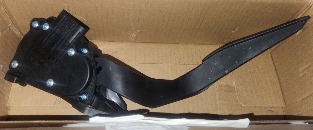 Dorman 699-105 Accelerator Pedal Compatible with Select Models – a box with a black plastic handle