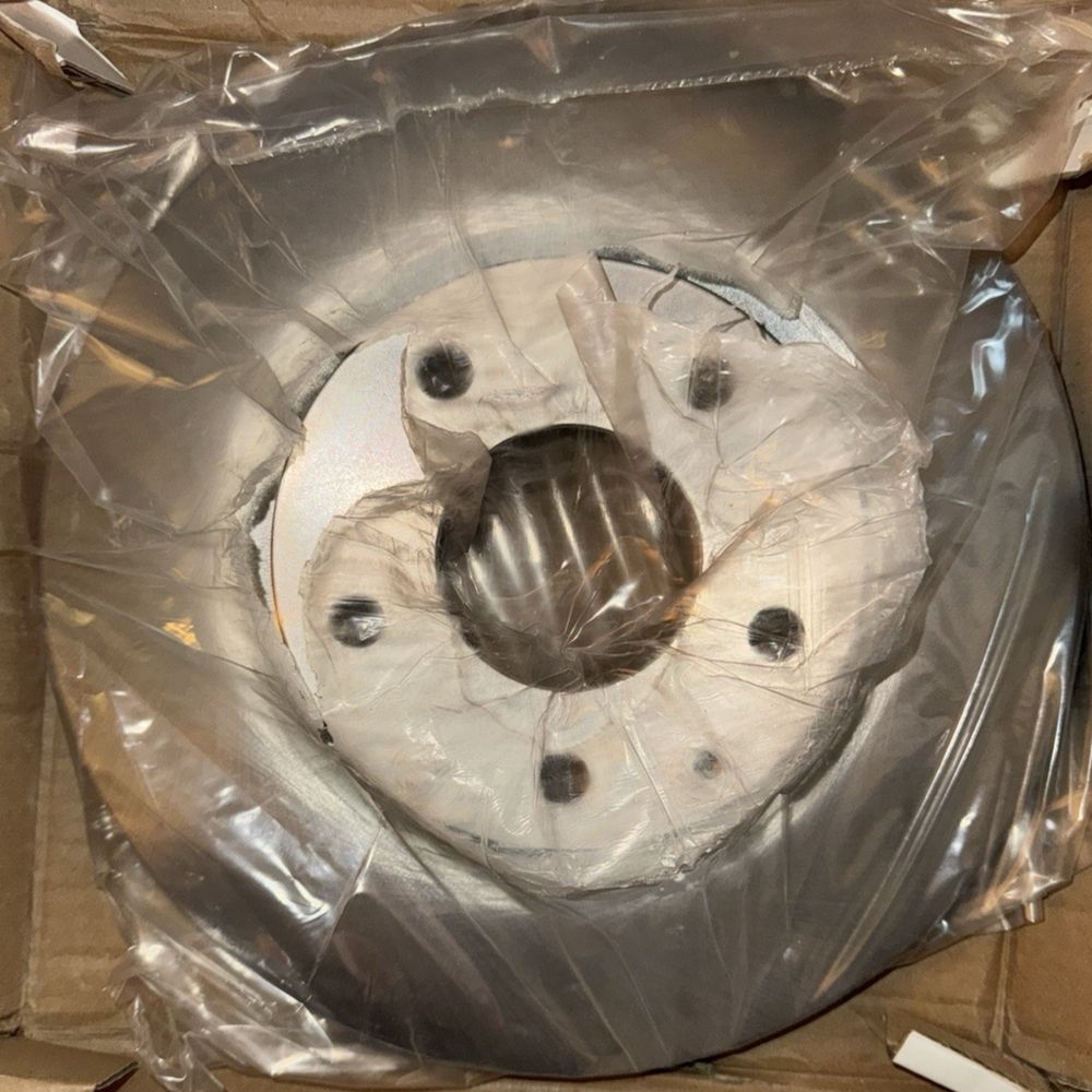 CMX 8-981421 Brake Disc Front for Mazda CX-3 3 Sport 2014- – a box with a toilet paper and a toilet brush