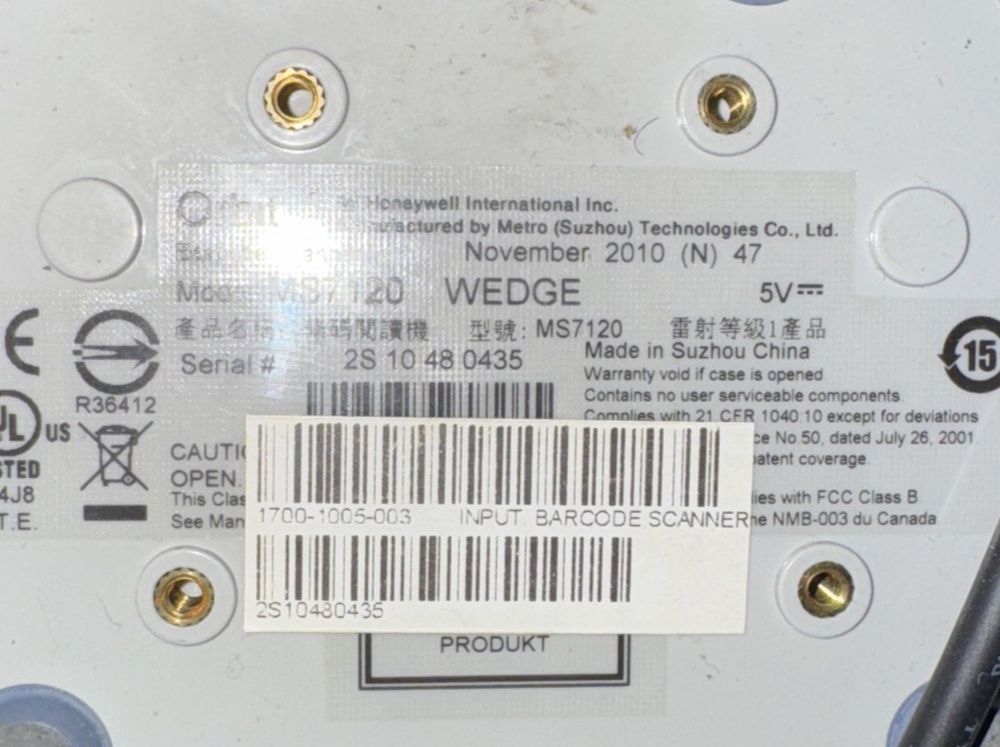 Orbit 7120 Hands-Free Scanner, Honeywell – a close up of a white and black label on a white and black label