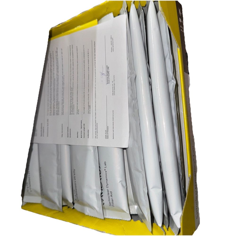 SartoClear Dynamics Lab Filter Aid C300 24 x pouches (Open box condition), Sarto Clear – a yellow box filled with papers and a white sheet