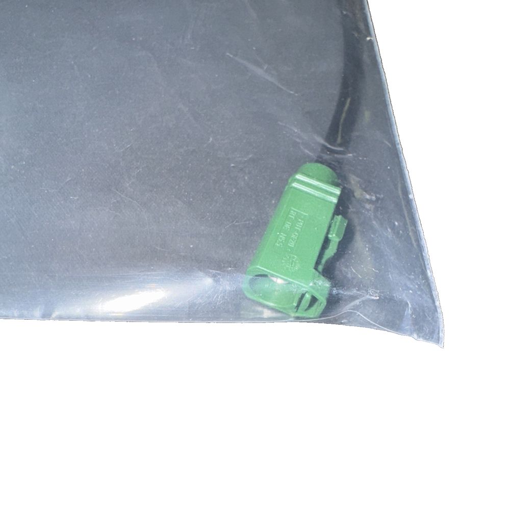HIRSCHMANN CAR COMMUNICATION CABLE 955-621-602 – a green plastic bag with a small green object inside
