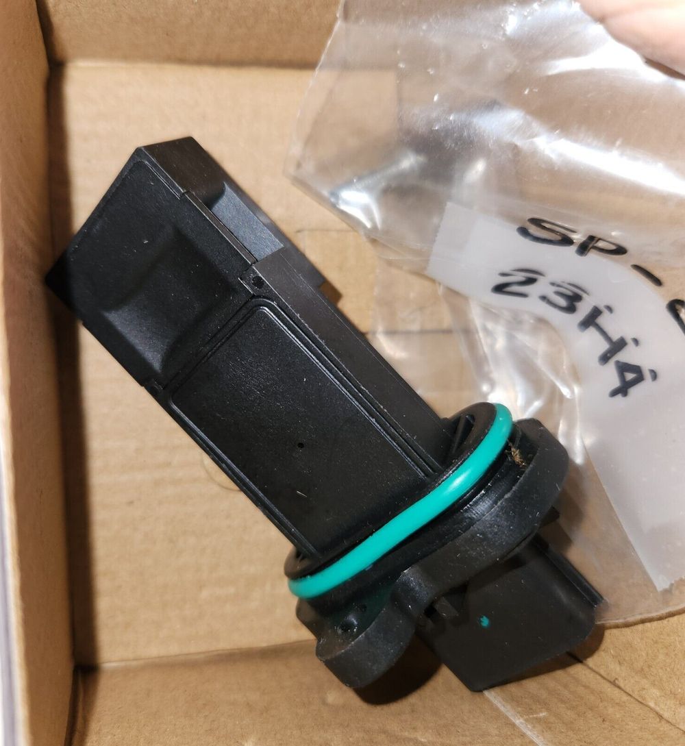 Walker Products 245-1314 Mass Air Flow Sensor Assembly – a box with a plastic bottle and a plastic bottle