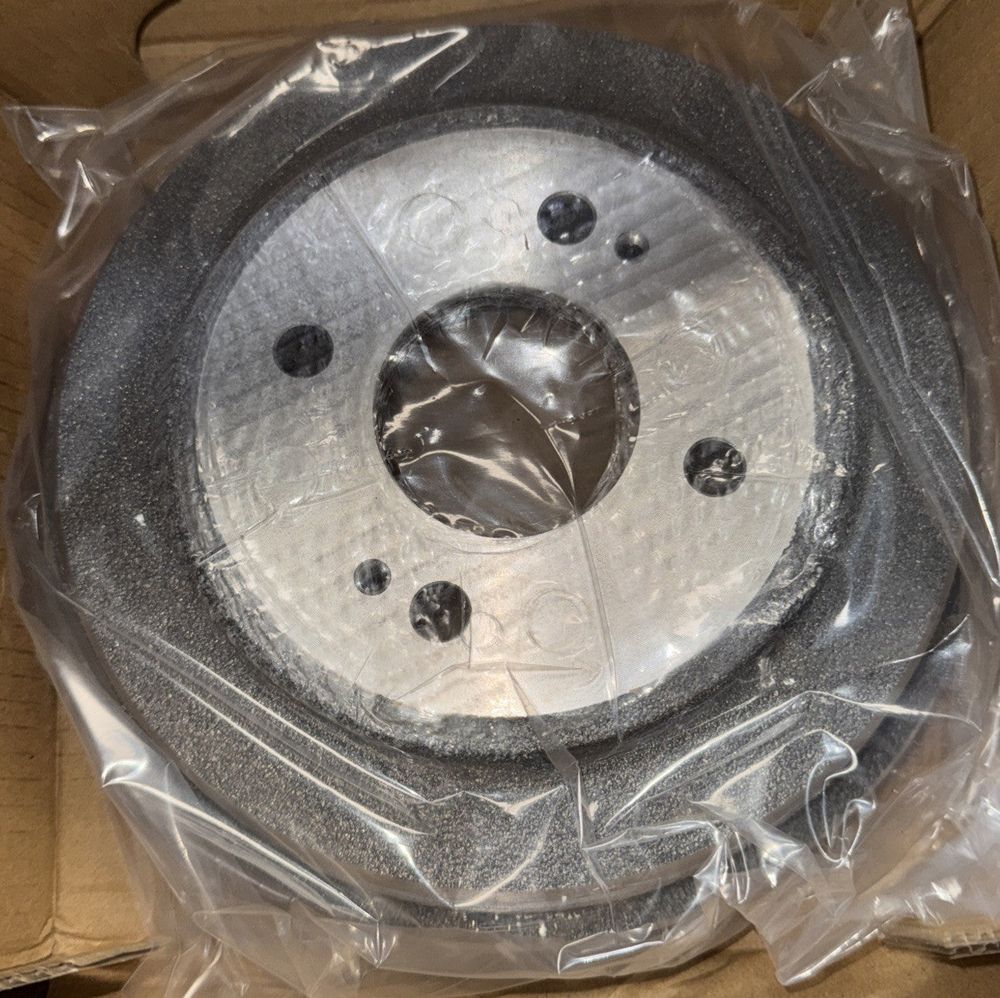 CMX Rear Brake Drum 8-9724 Replacement For Honda Civic – a metal disc with a hole in it