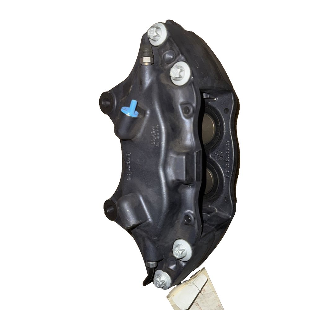 Front Brake Caliper M12 RH For Tesla - Brembo – a black plastic mask with a white background
