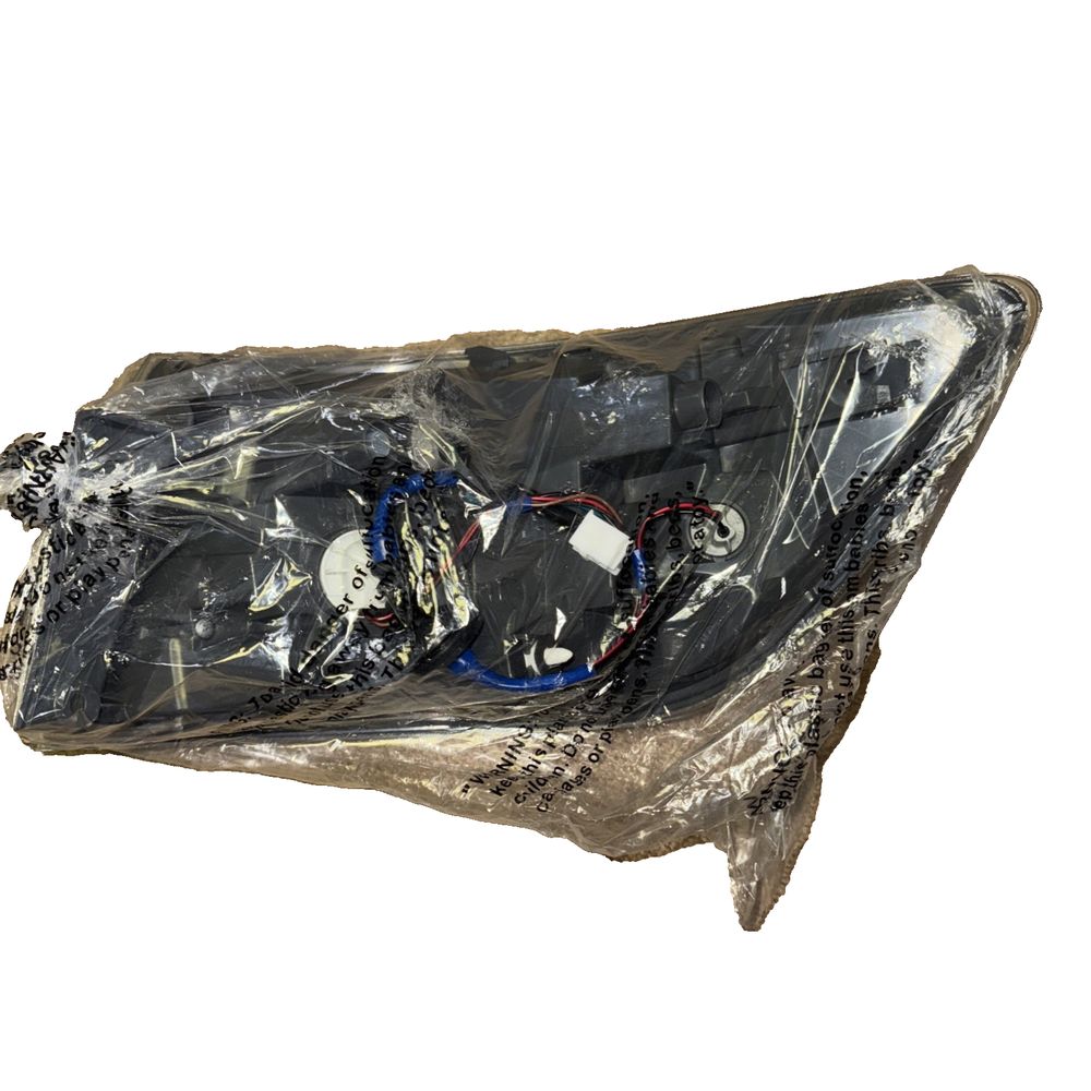 TYC 11-6422-00 Mazda CX-9 Replacement Tail Lamp – a black plastic bag with a white and black design