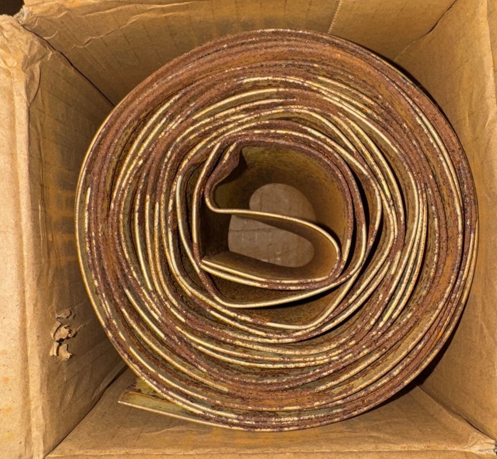 Meyoppm Corten Steel Garden Edging 5.5"x16.4' (Rusted By Design) – a roll of brown paper in a cardboard box