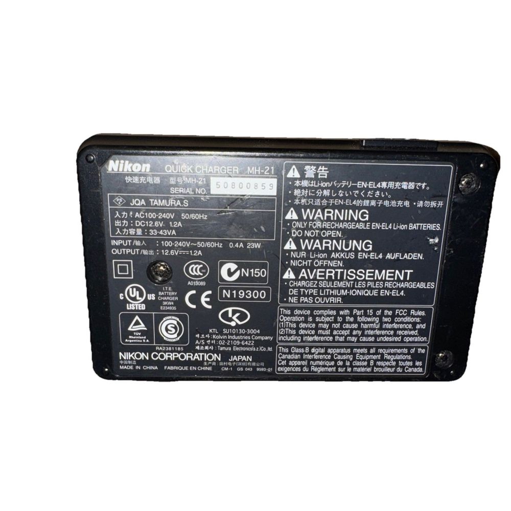 Nikon MH-21 Quick Charger No Power Cable – a black and white photo of a power unit