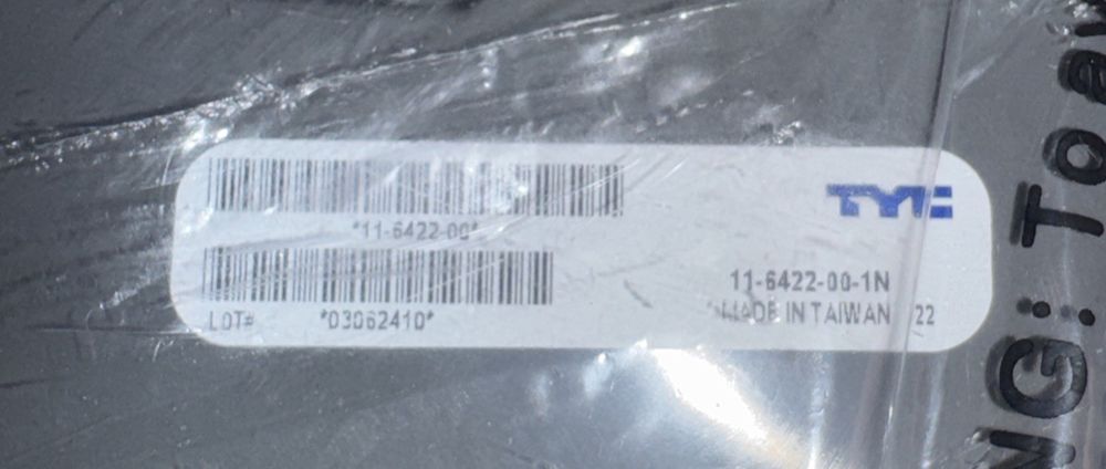 TYC 11-6422-00 Mazda CX-9 Replacement Tail Lamp – a label on a piece of plastic