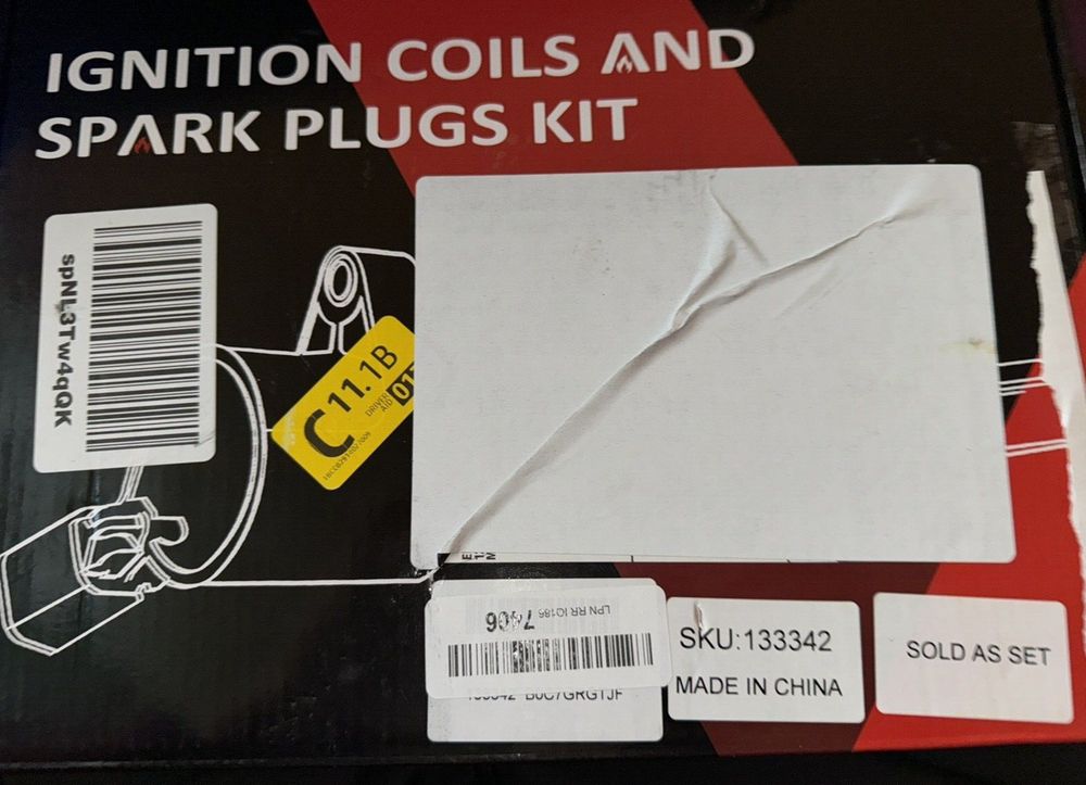 SCITOO 4 ignition coils with 4 iridium Spark Plugs for Subaru Forester 2.5L H4 – a box with a label on it