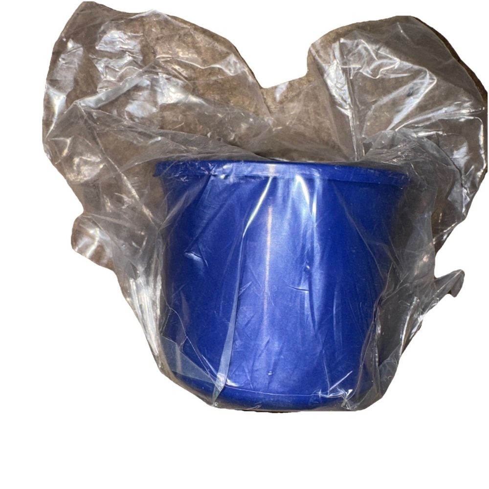 E46 (Non-M), Z4 Solid Delrin Rear Differential Carrier Bushing – a blue plastic cup with a plastic wrap around it