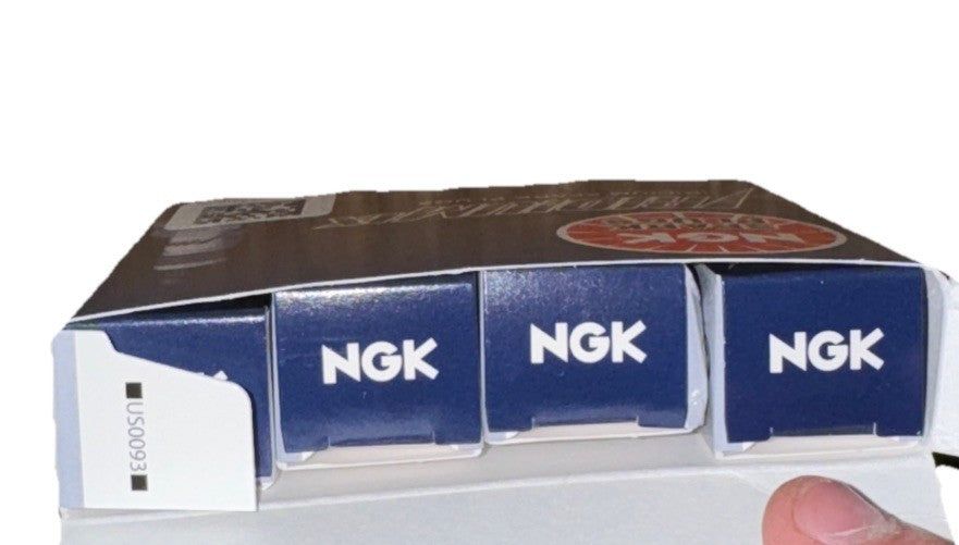 NGK 4469 Spark Plug 4 Pack – a person holding a box of cigarettes