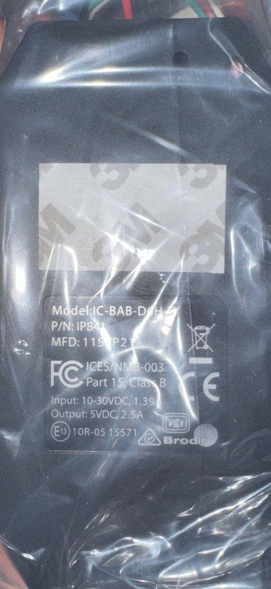 Brodit Power Supply for Nautiz X6 Vehicle Dock IP841 – a black plastic bag with a white label