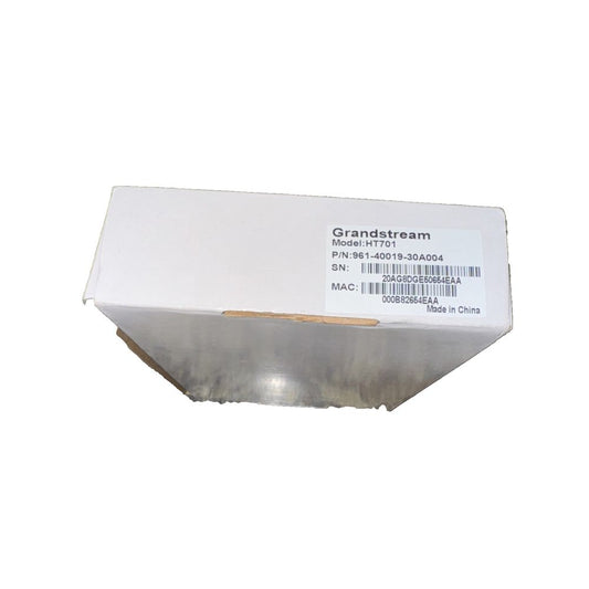 Vonage - HT701 Grandstream – a white box with a white label on it