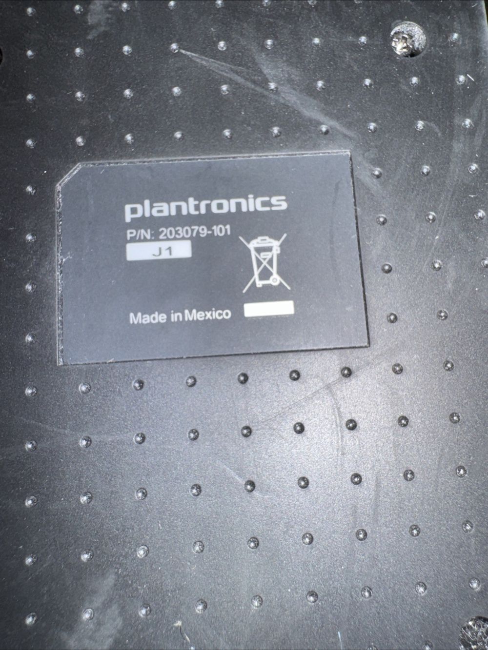 Plantronics 203-79-101 Headset Dock – a close up of a laptop with a sticker on it