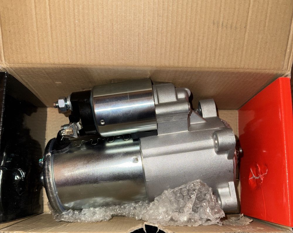 A-Premium Starter Motor Compatible with Ford Expedition, Excursion, F150 F250 F3 – a box with a red handle and a metal object inside