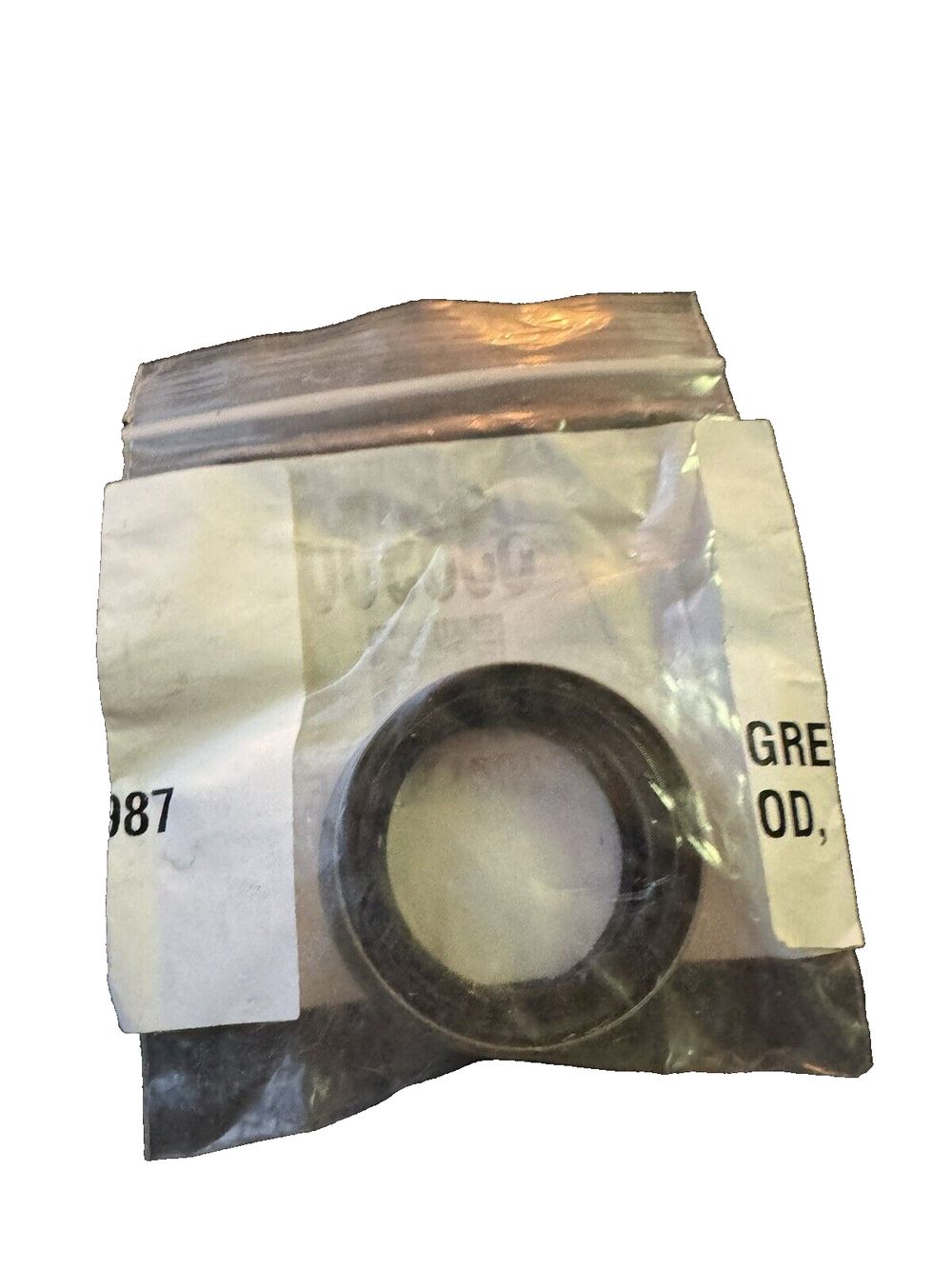 Lippert Replacement Double Lip Grease Seal for 1,250 to 8,000-lb. RV Trailer Ax – a piece of plastic tape with a white background