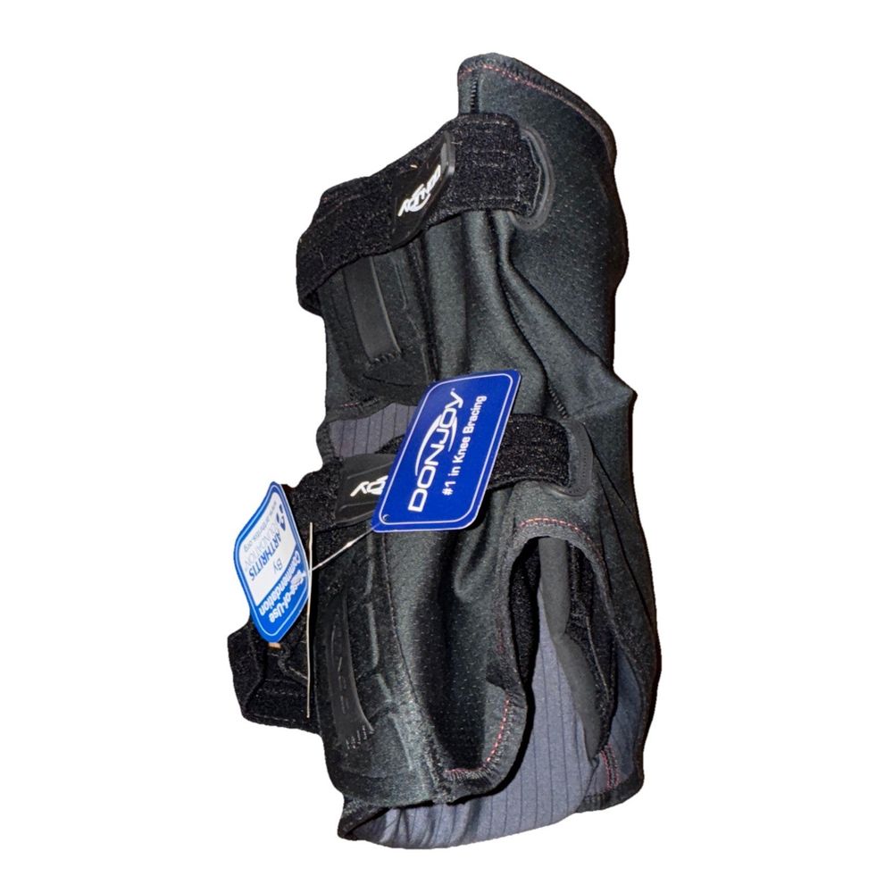 Donjoy Clima-Flex Knee Brace – a pair of black gloves with a blue tag on the back