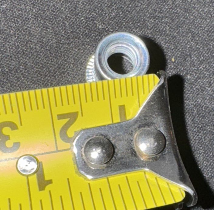 Riv Nut 100 Pack, Unbranded – a yellow tape measures the width of a metal object