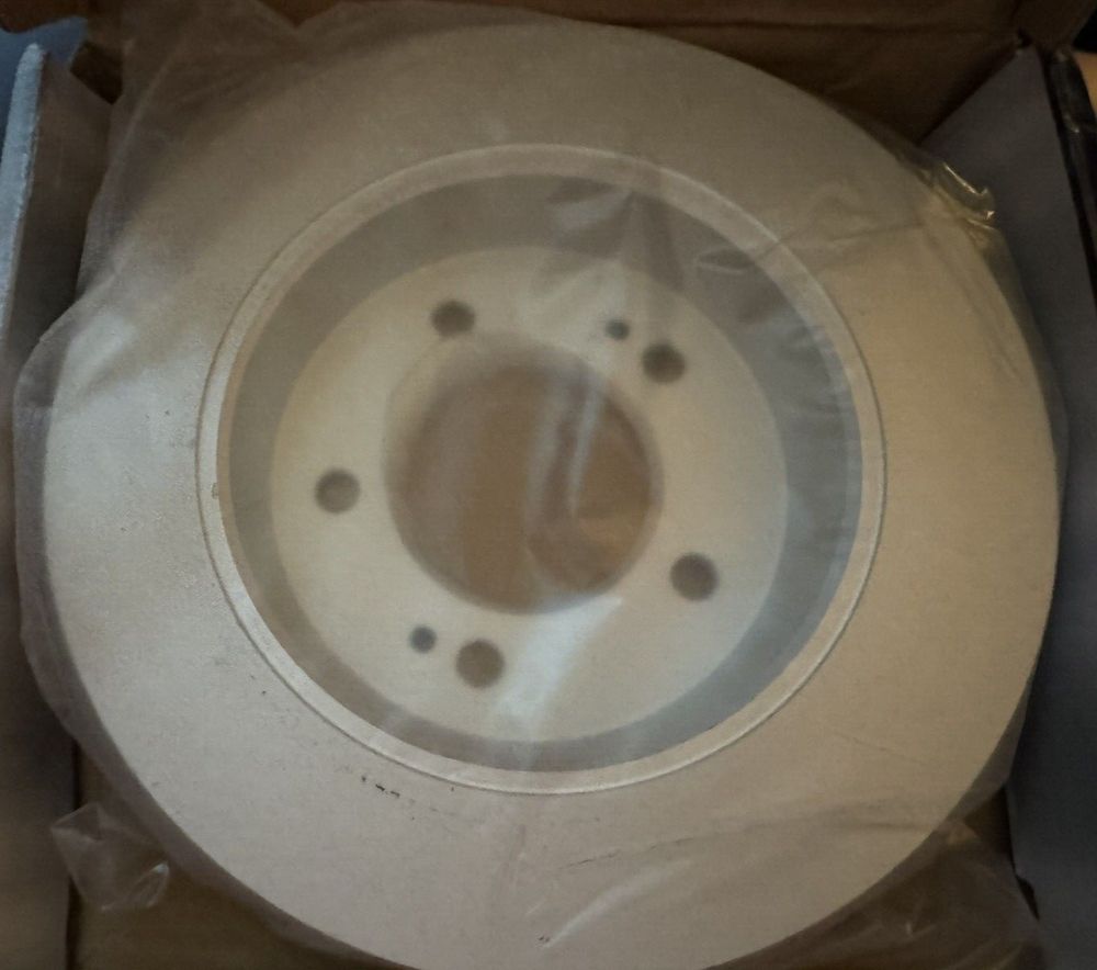 Raybestos 980957FZN Rust Prevention Technology Coated Rotor Brake Rotor, 1 Pack – a white toilet bowl