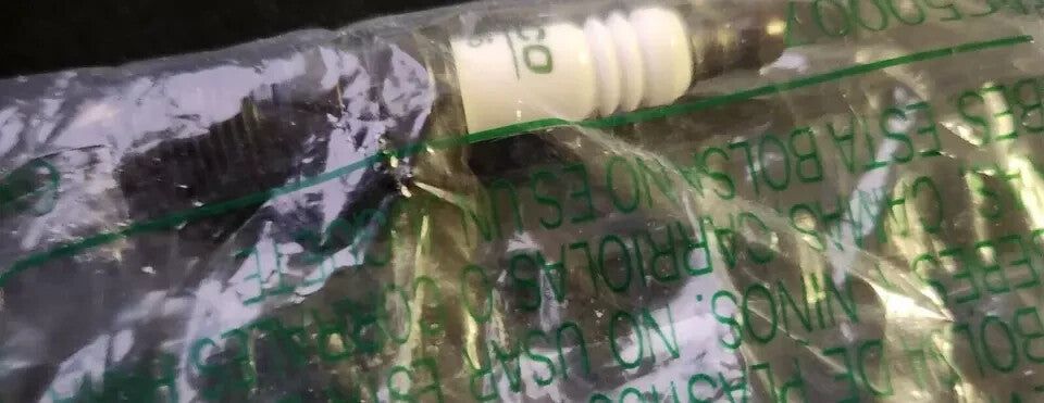 ACDelco GM Original Equipment R44LTS6 Conventional Spark Plug – a plastic bag with a plastic bottle inside