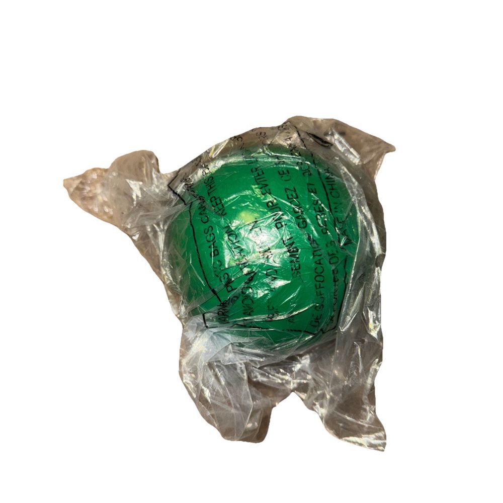 Stott Pilates Toning Ball 3lbs - Green – a green ball wrapped in plastic wrap
