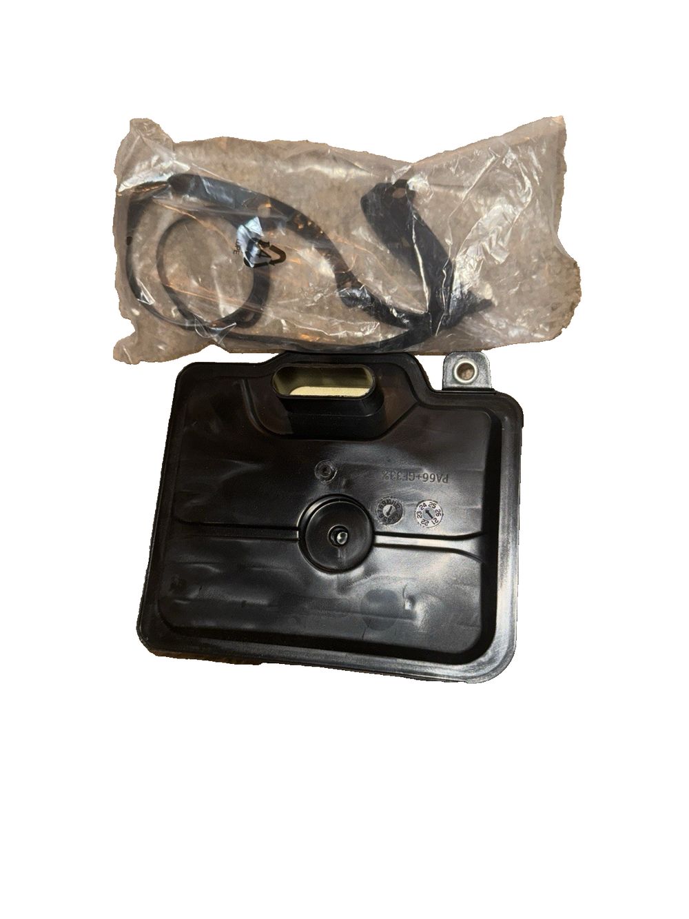 Wix 58128 Automatic Transmission Filter – a black plastic bag with a pair of glasses