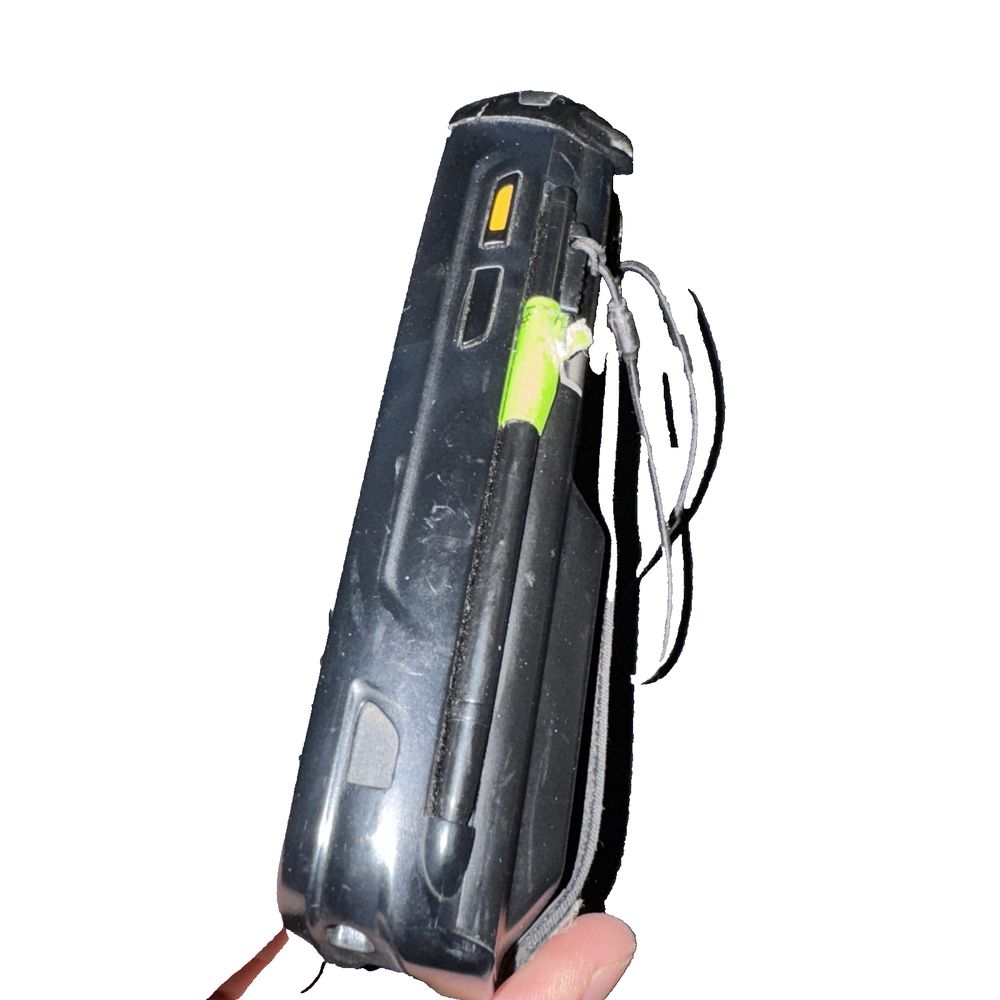 Zebra MC659B For Parts/Repair – a hand holding a black and yellow flashlight