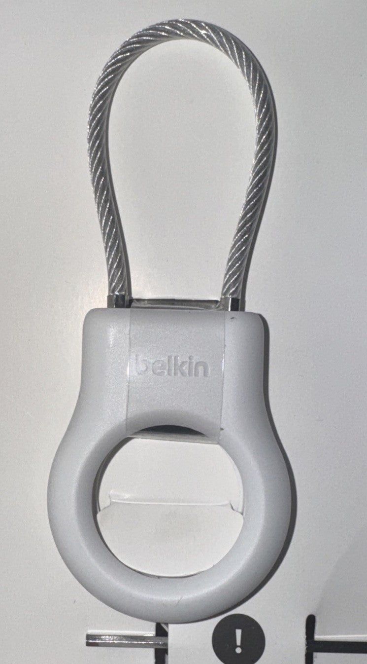 Belkin Secure Holder with Wire Cable for AirTag – a white ring with a black ring on it