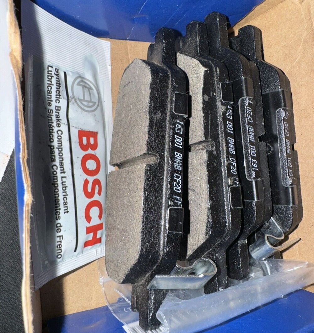 BOSCH BE2037H Blue Ceramic Disc Brake Pad Set With Hardware - Compatible With Se – a box of brake pads and a pair of brake pads