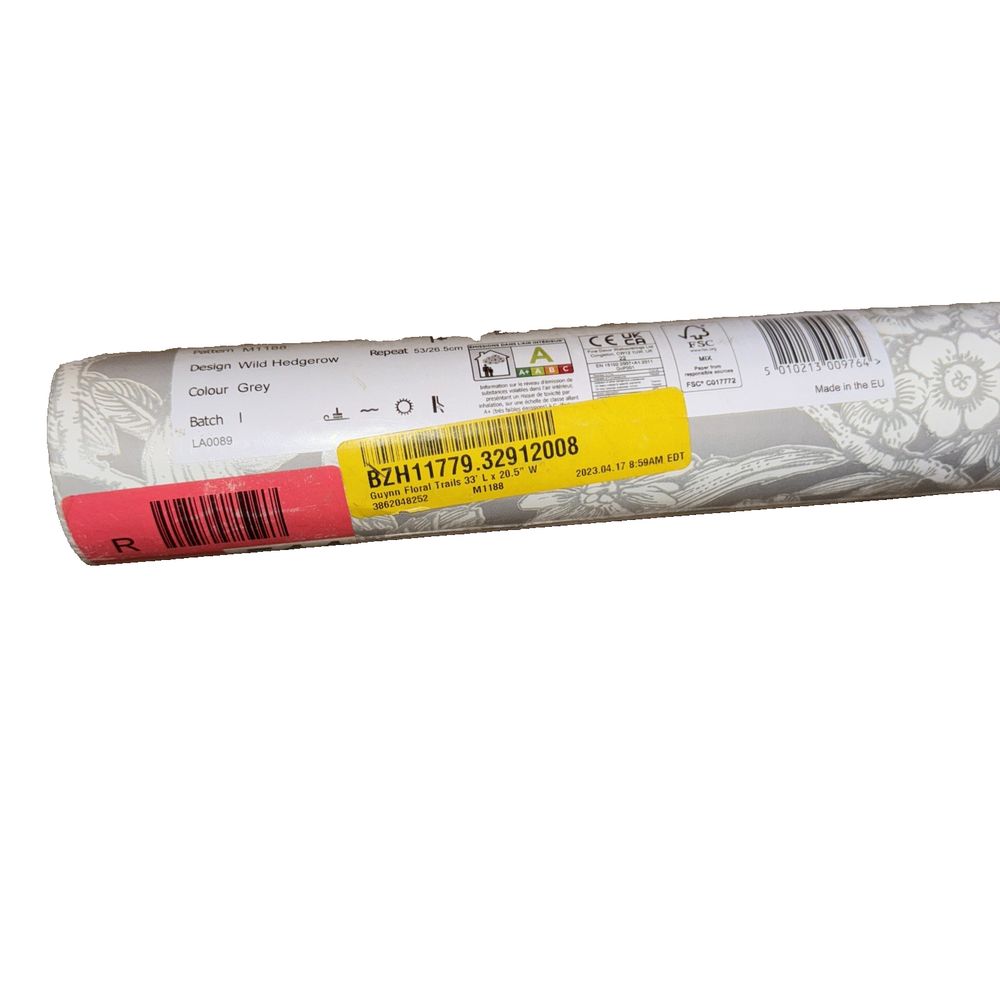 CROWN GREY METALLIC LEAF WILD HEDGEROW Luxury Wallpaper, Crown WallCoverings – a roll of white paper with a red stripe