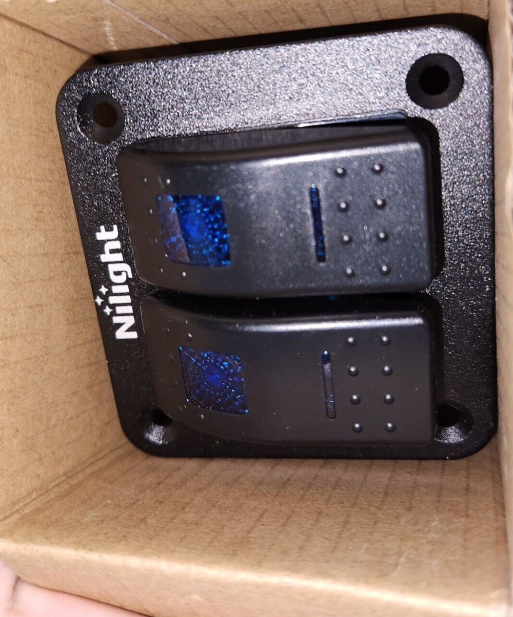 Nilight 90106B 2 Gang Rocker Switch Panel 5 Pin On Off Pre-Wired Rocker Switch A – a box with a black and blue light inside