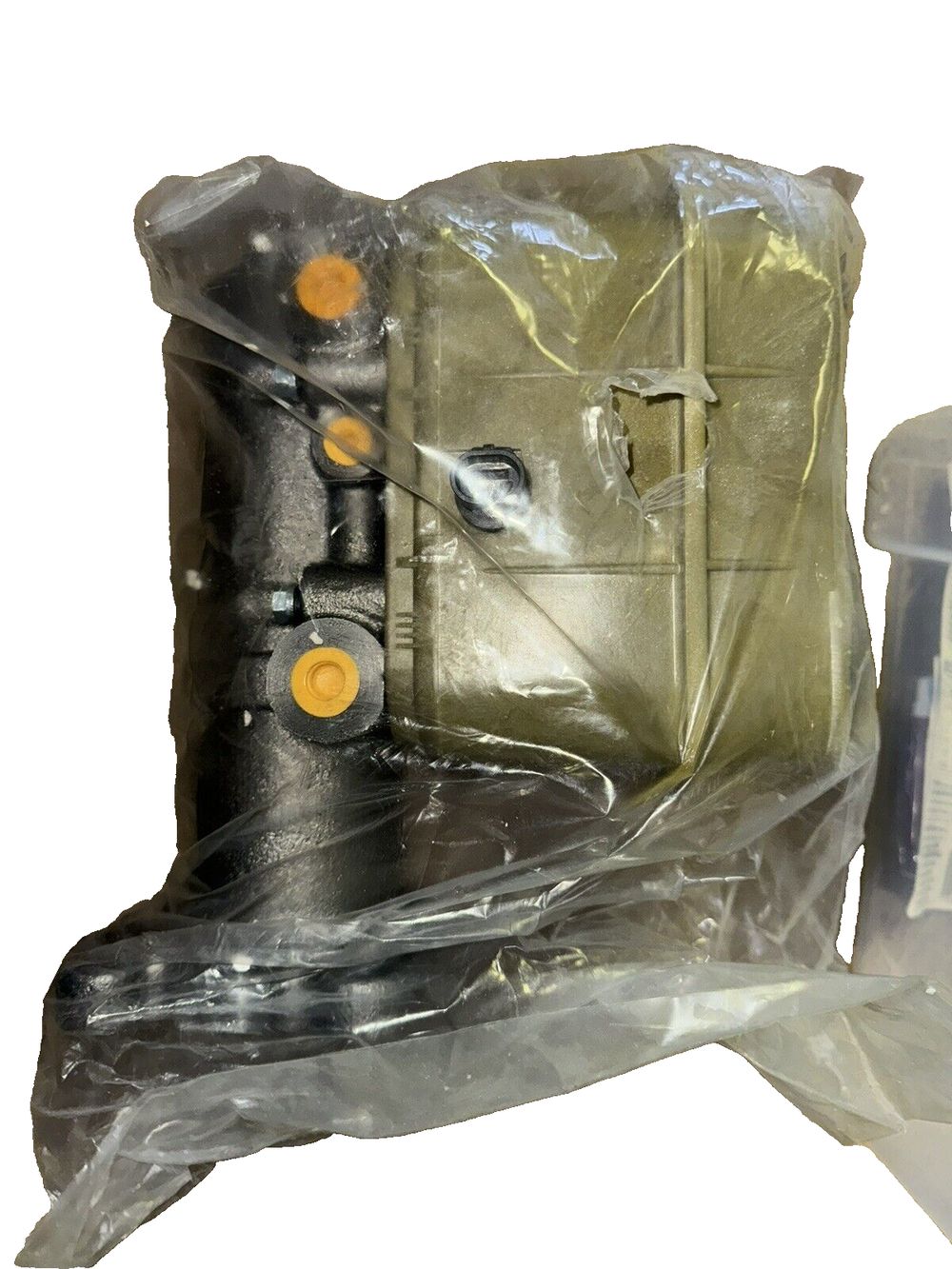 Dorman M630276 Brake Master Cylinder Compatible with Select Models – a bag with a piece of plastic in it