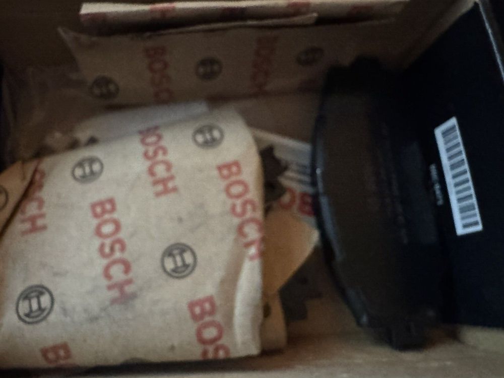 BOSCH BC1210 QuietCast Premium Ceramic Disc Brake Pad Set - Compatible With Sel – a box with a piece of pizza inside of it