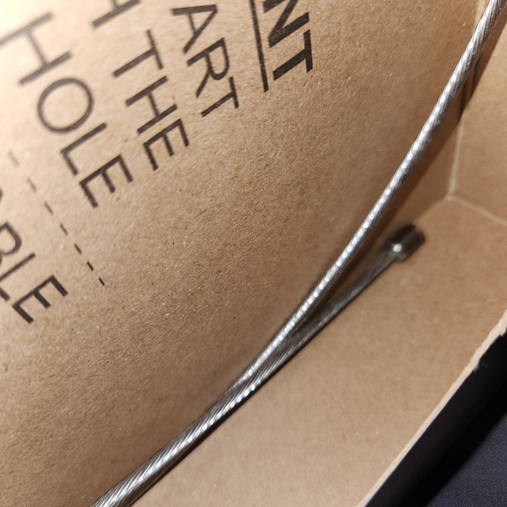 Dorman C661240 Parking Brake Cable – a box with a metal handle and a metal handle