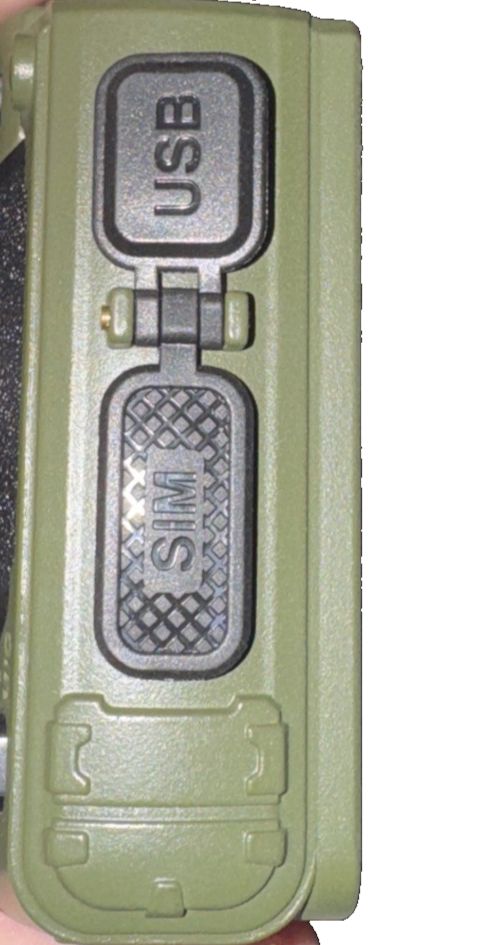Motorola 2 Way Walkie Talkie Talkabout (No Batteries/Cords) – a hand holding a green remote control device