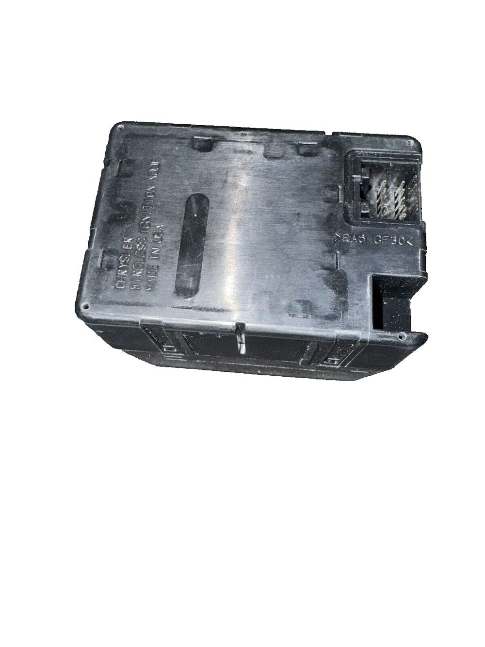 Wireless Chrysler Ignition Module 68105739AC – a metal box with a metal cover