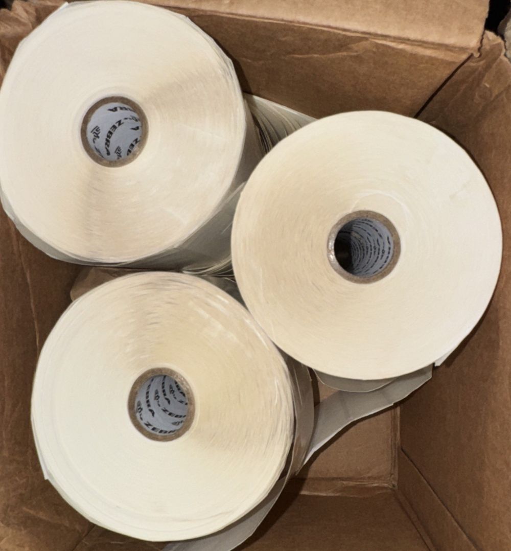 10010045 - Zebra 4" x 1" Z-Select 4000D Label (Case) – three rolls of white paper in a cardboard box