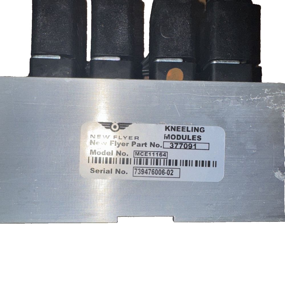 MCE11164 | Genuine Parker Kneeling Module, New Flyer – a close up of a metal plate with a label on it