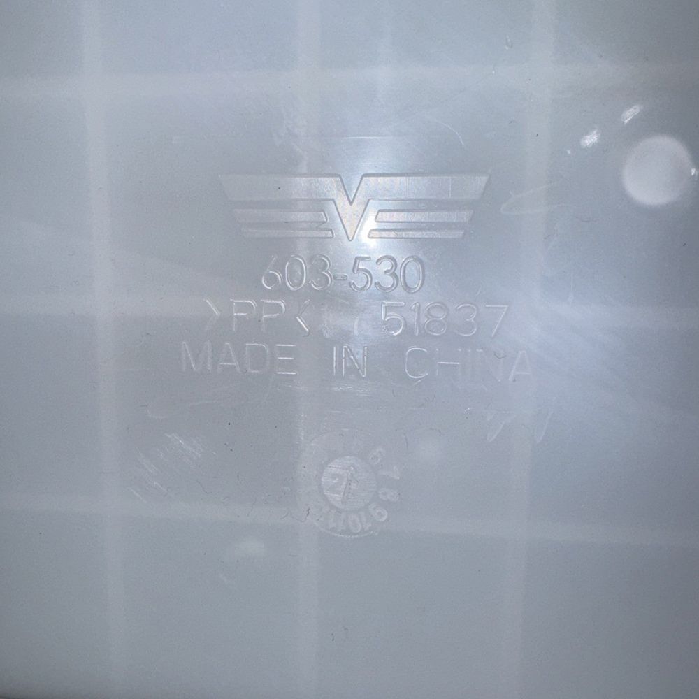 2007-2010 HYUNDAI SANTA FE DORMAN (OE SOLUTIONS) - 603-530 - Washer Fluid Tank – a close up of a white refrigerator with a logo on it