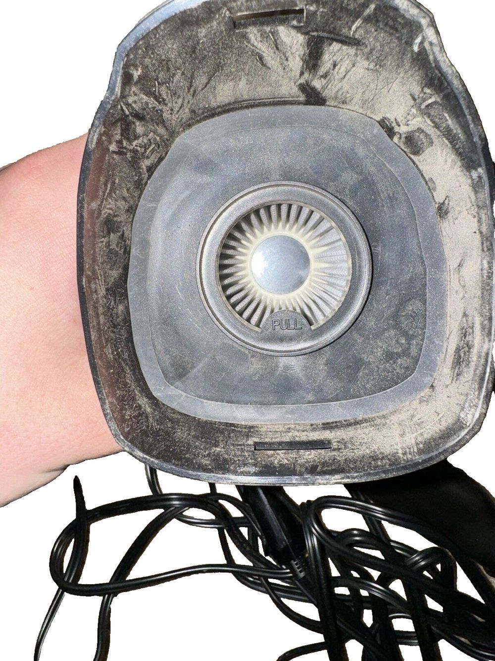AstroAI Car Vacuum, Portable Vacuum Cleaner with 7500PA-12V High Power, LED Ligh – a hand holding a small blower with a hose