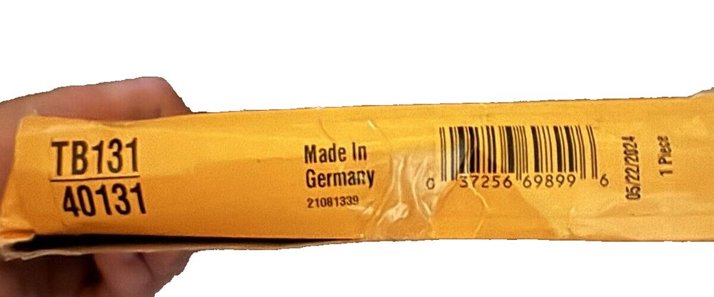 Continental TB131 Metric Timing Belt – a hand holding a yellow plastic bag with a barcode
