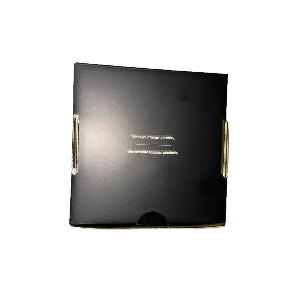 NEW Motive Smart DashCam DC-33 – a black notebook with a pen on top