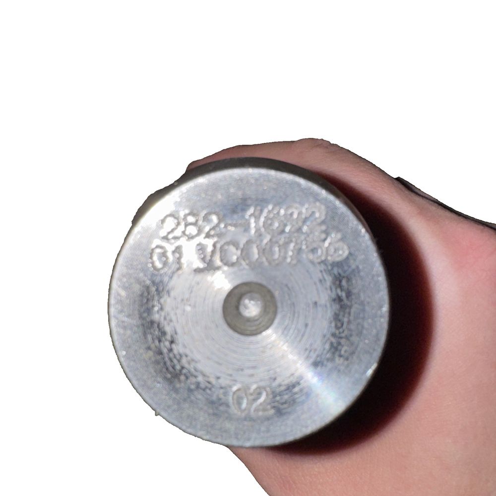 282-1692: 45mm Outside Diameter Linkage Pin, Unbranded – a person holding a silver object in their hand