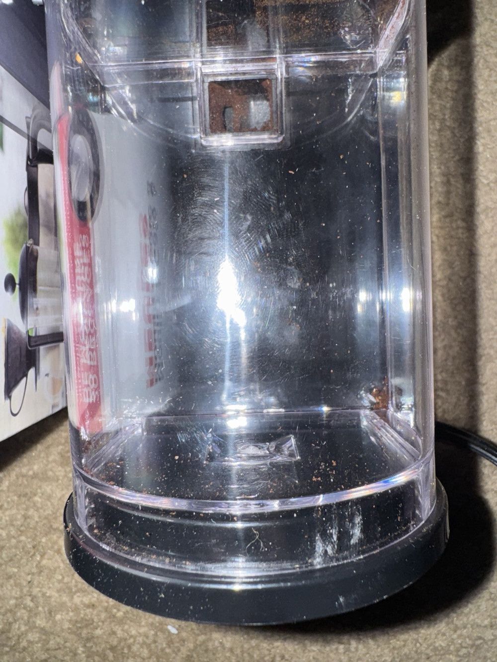Black + Decker Burr Mill Coffee Grinder, BLACK+DECKER – a blender sitting on a counter with a magazine on the wall