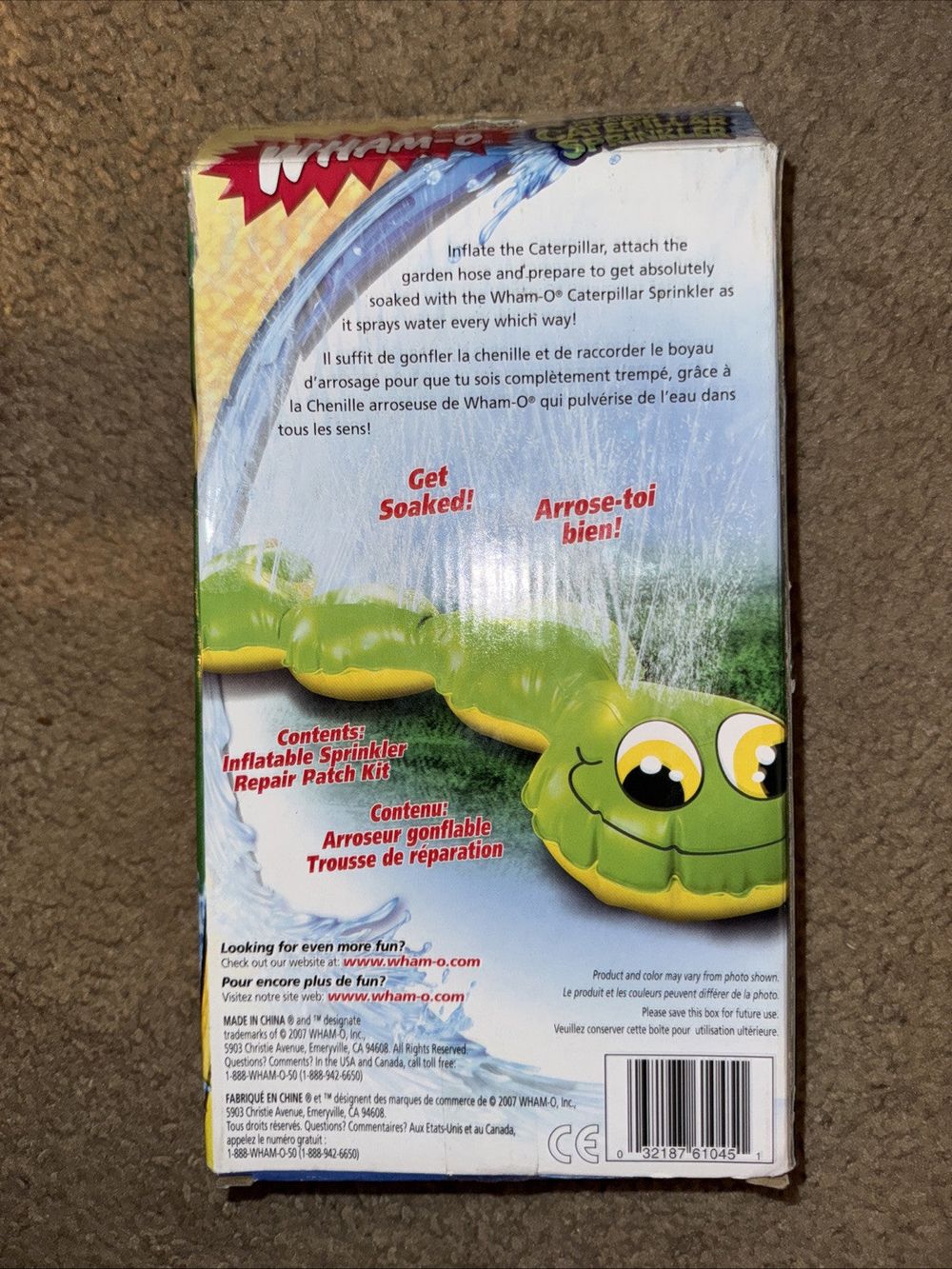 Wham-O Inflatable Caterpillar Sprinkler Water Toy – a magazine with a picture of a green frog