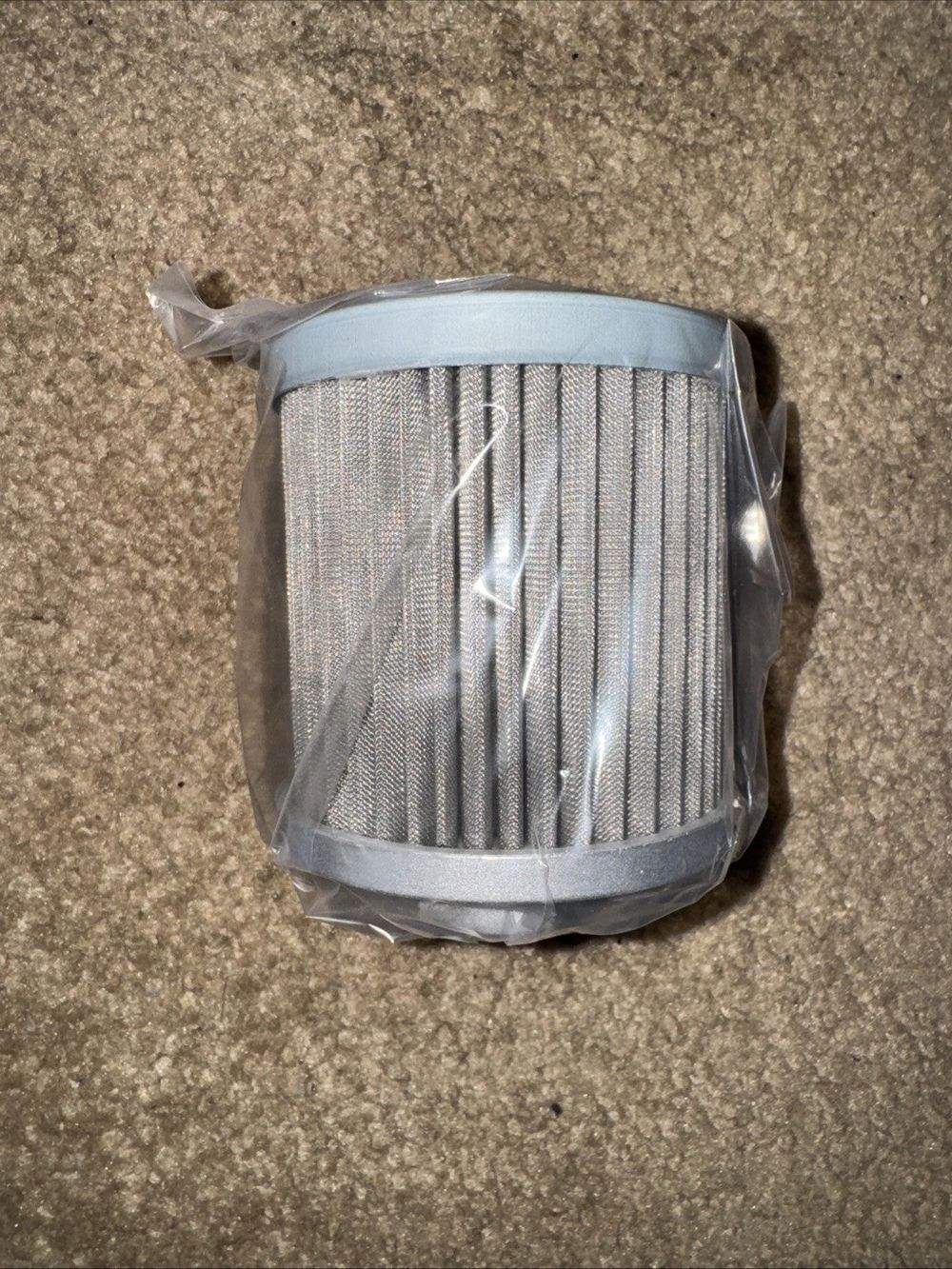 Hero RSURB23862150 Hydraulic Oil Filter – a close up of a metal mesh on a carpet